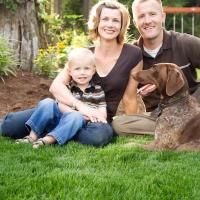 family sitting on the lawn