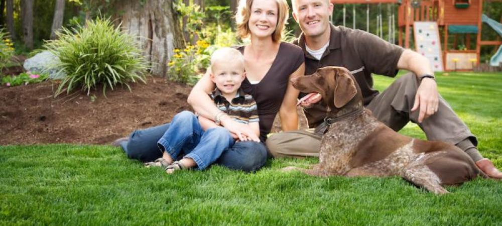 family sitting on the lawn